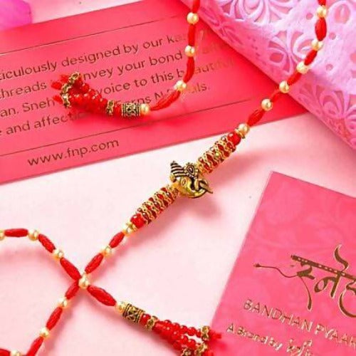 Ganesha Pearl Rakhi & Handmade Chocolate Truffle Combo