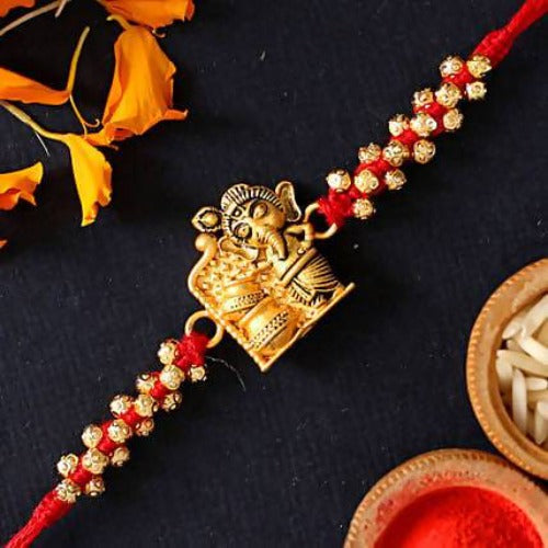 Cute Ganesha Rakhi and Almond Treat Chocolate