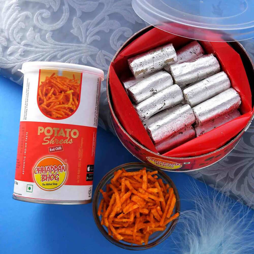 2 Divine Om Rakhis & Pista Kaju Roll Box Hamper Combo