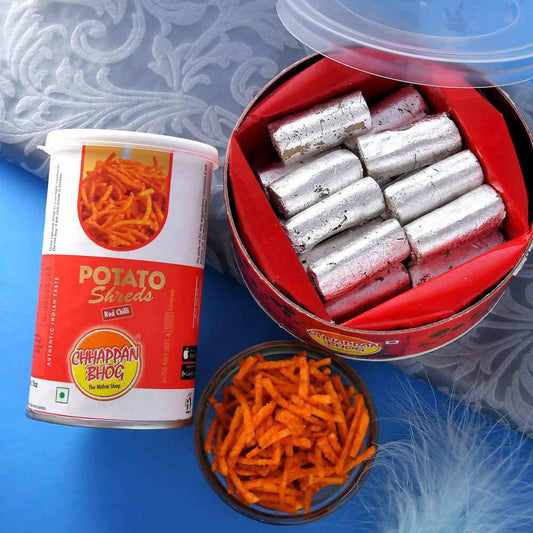2 Divine Om Rakhis & Pista Kaju Roll Box Hamper Combo