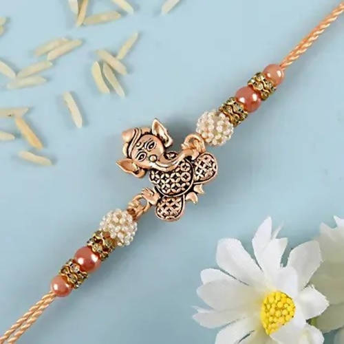 Enticing Ganesha Rakhi & Amul Milk Chocolate Flow Wraps